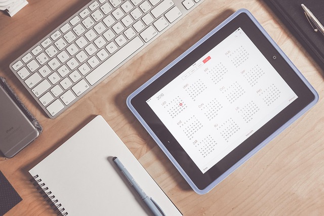 calendar, computer, notebook to plan your business exit strategy years in advance