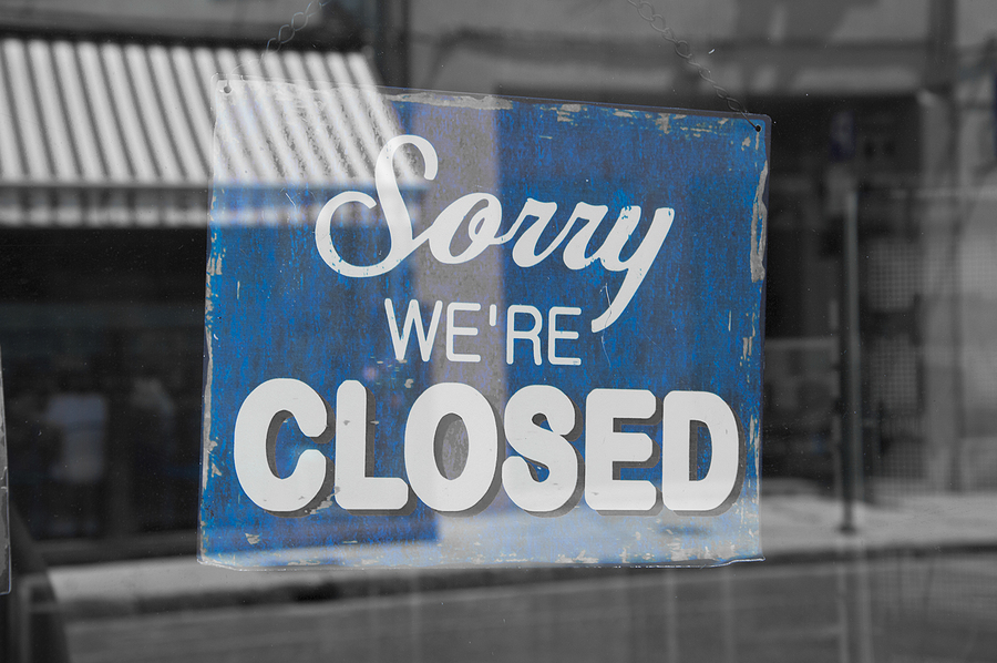 sorry we're closed  blue sign with white letters