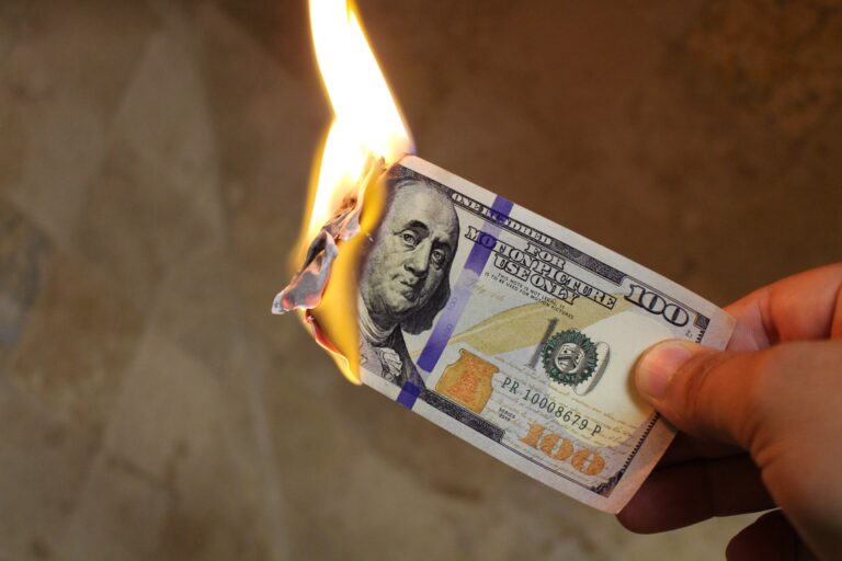 100 dollar bill lit on fire
