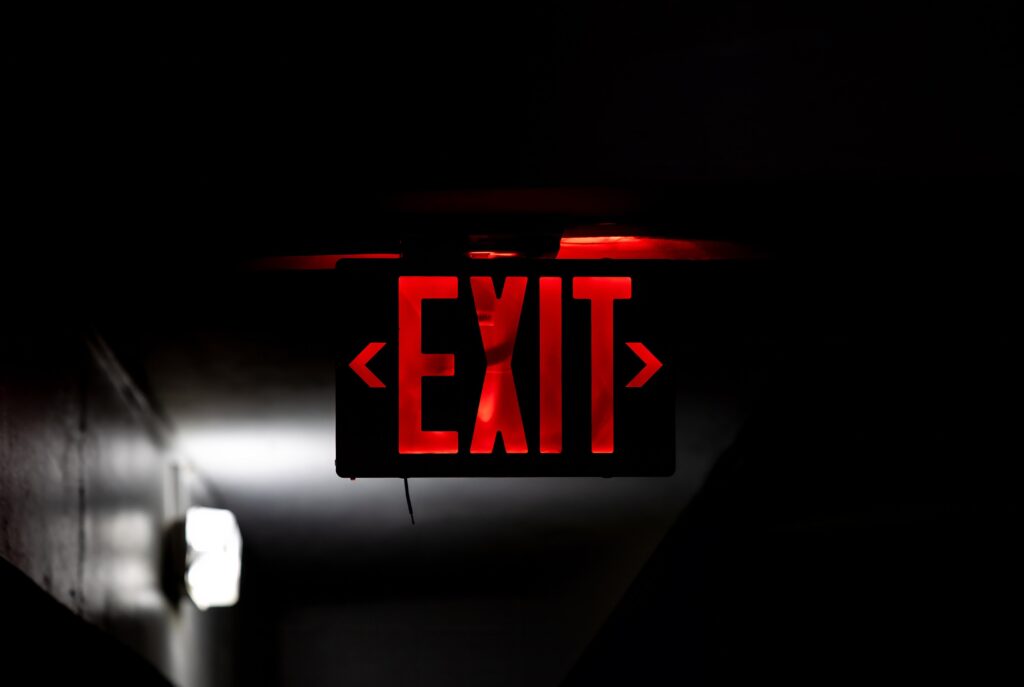 exit sign in dimly lit space